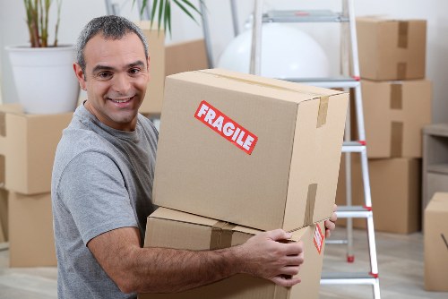 Commercial moving team preparing office equipment for relocation in Collierswood