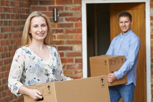 Professional movers coordinating an office relocation schedule