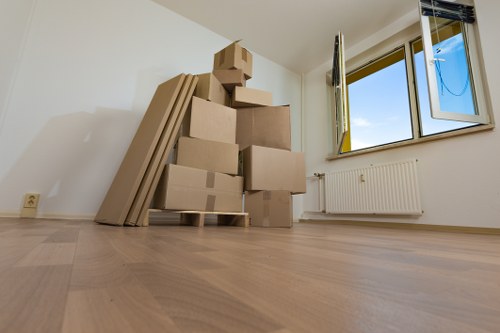 Packed boxes and protective wrapping prepared for a domestic relocation