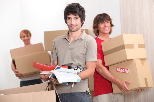 Removal team handling furniture and boxes for a local home move