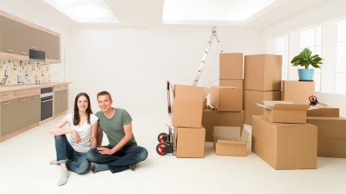 Moving team arranging furniture during a Collierswood relocation