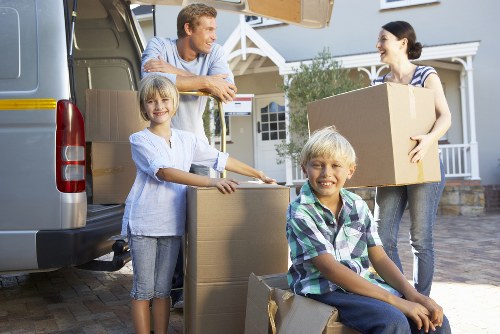Careful loading of household items by a local man and van team