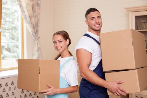 Careful wrapping and boxing of household items for relocation