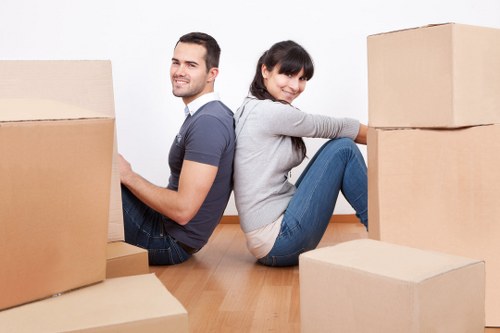 Household furniture being prepared for transport by local removal company